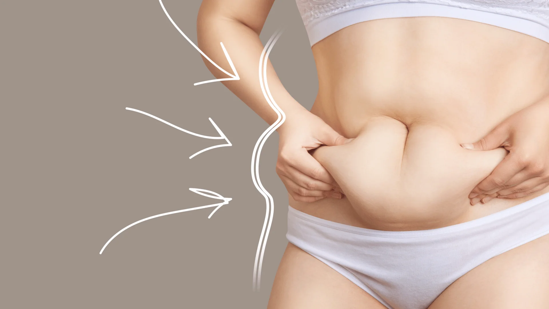 Person pinching belly fat to highlight excess abdominal fat against a beige backdrop with white arrow doodles on the left.
